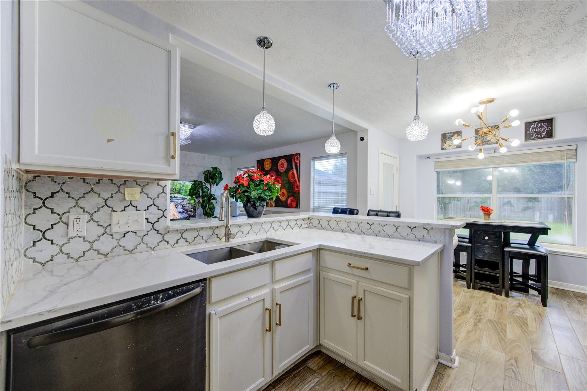 19334 Strathmore Pl Lane Katy, TX 77449 - Photo 16 of 48 a kitchen with a sink and cabinets