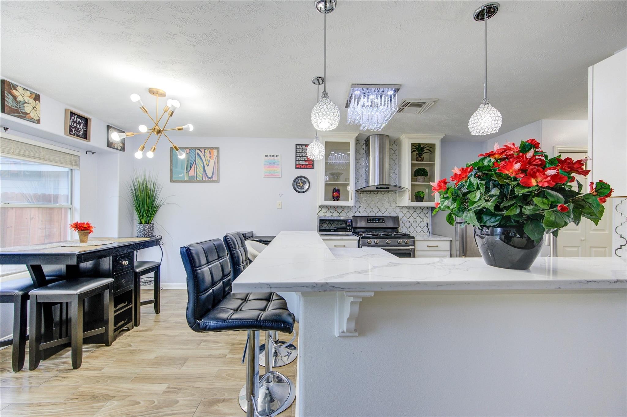 19334 Strathmore Pl Lane Katy, TX 77449 - Photo 17 of 48 a view of a dining room with furniture and chandelier