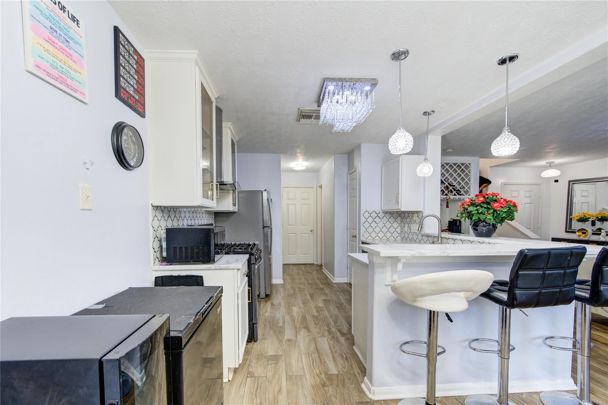 19334 Strathmore Pl Lane Katy, TX 77449 - Photo 18 of 48 a kitchen with a table and chairs in it