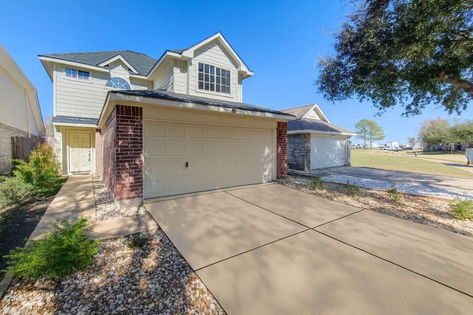 19334 Strathmore Pl Lane Katy, TX 77449 - Photo 2 of 48 a front view of a house with a yard and garage
