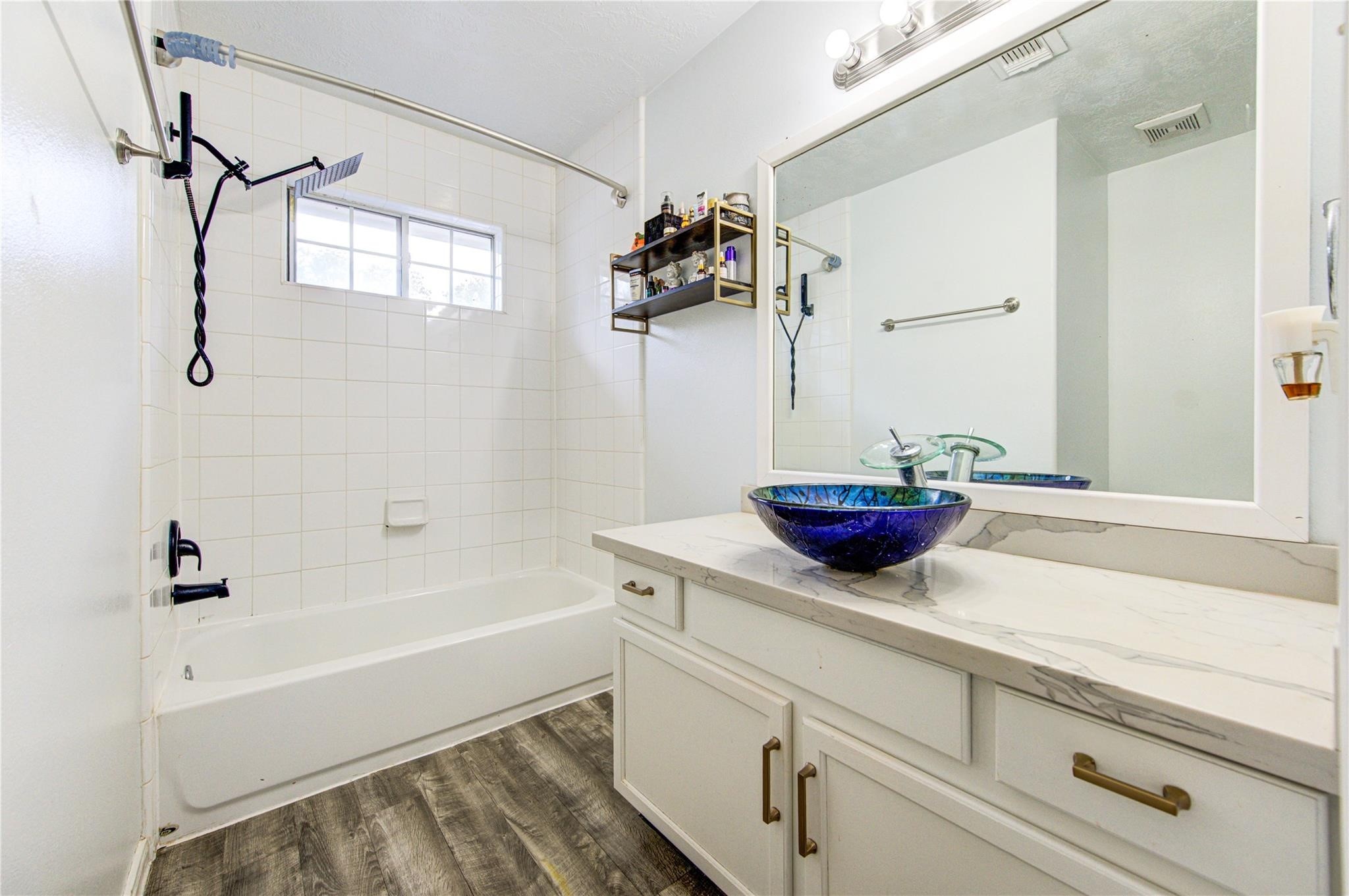 19334 Strathmore Pl Lane Katy, TX 77449 - Photo 30 of 48 a bathroom with a tub sink and mirror