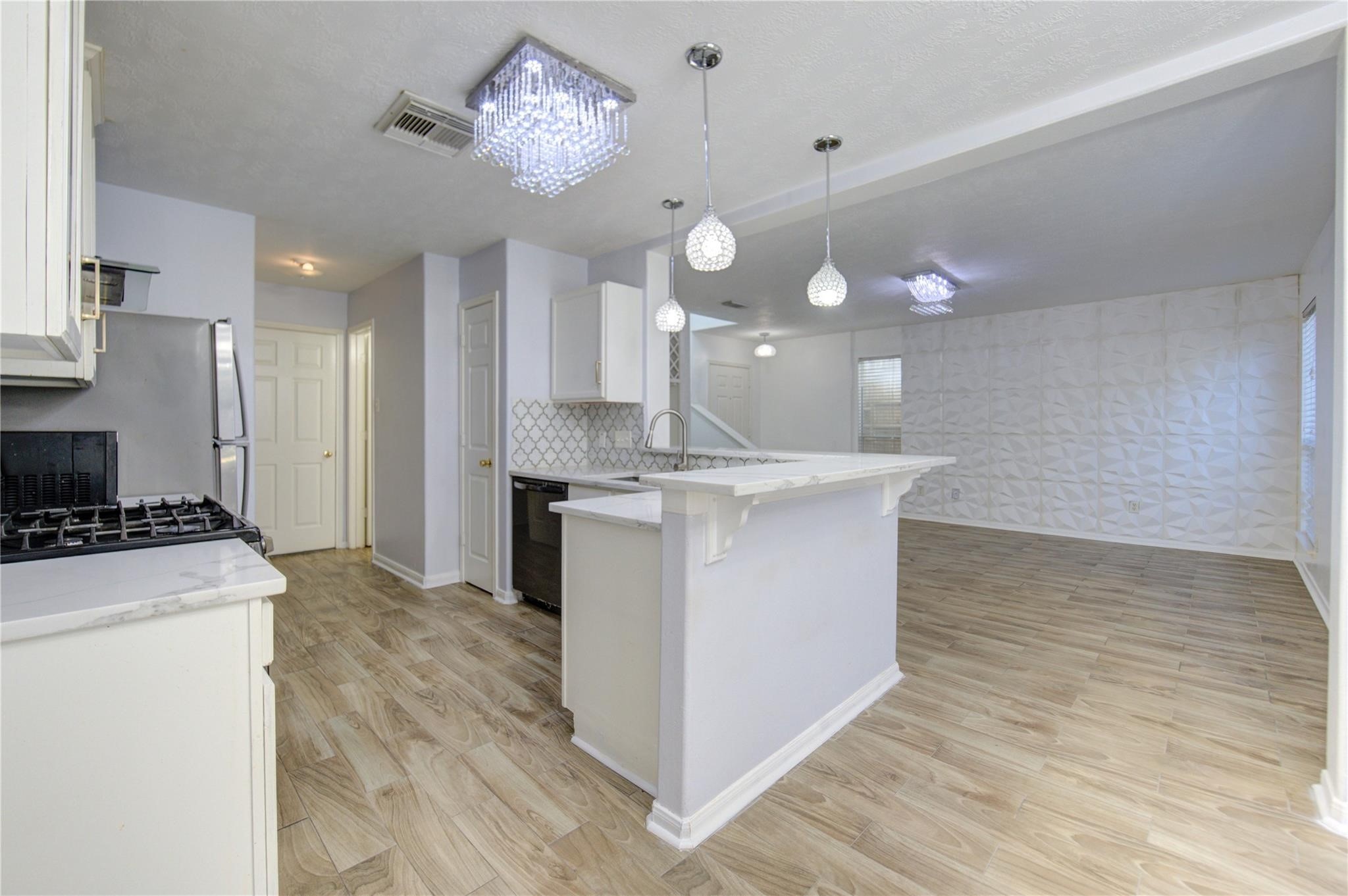 19334 Strathmore Pl Lane Katy, TX 77449 - Photo 34 of 48 a kitchen with stainless steel appliances granite countertop a sink a stove and a refrigerator