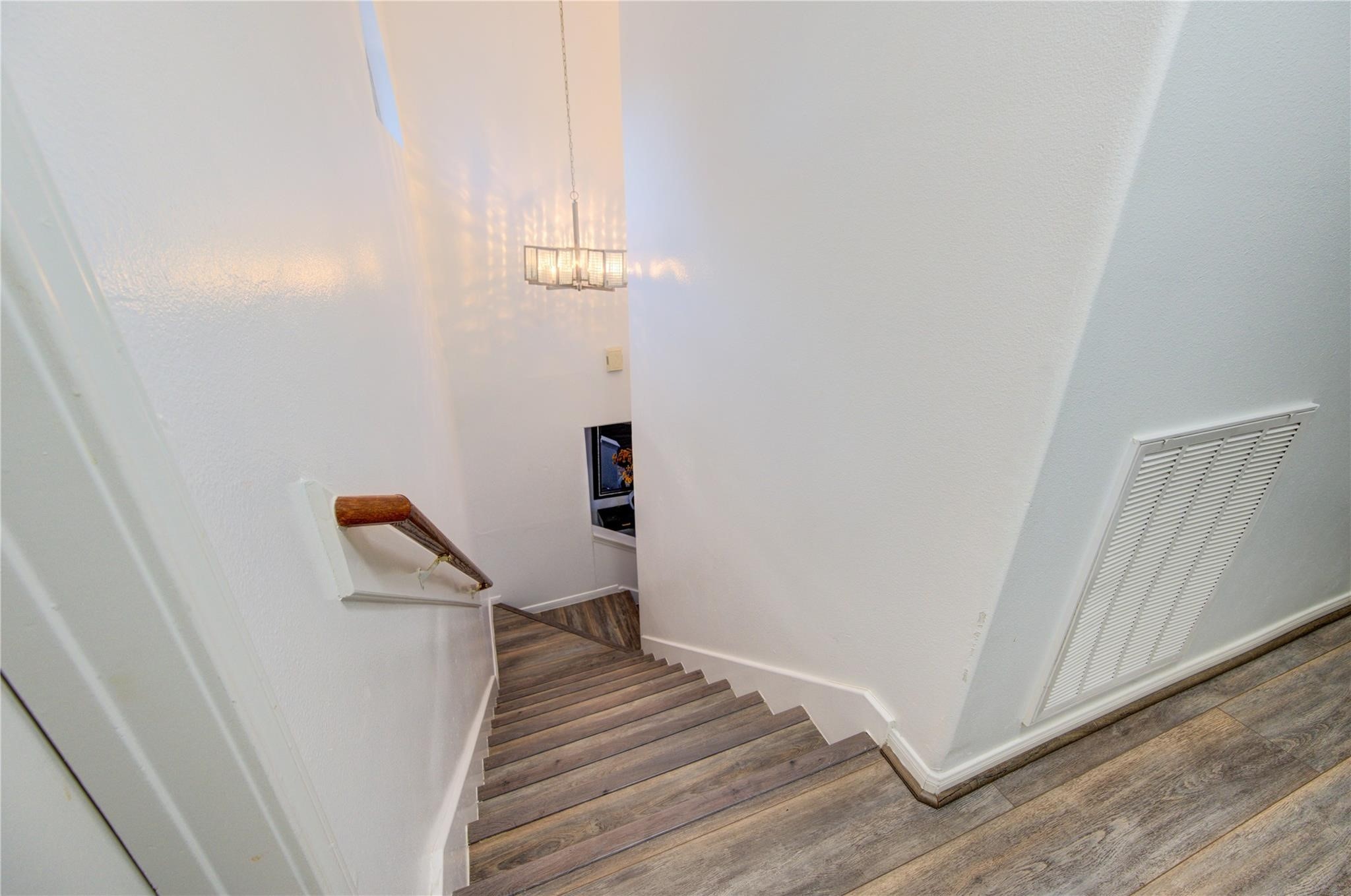 19334 Strathmore Pl Lane Katy, TX 77449 - Photo 37 of 48 a view of a livingroom with wooden floor and stairs