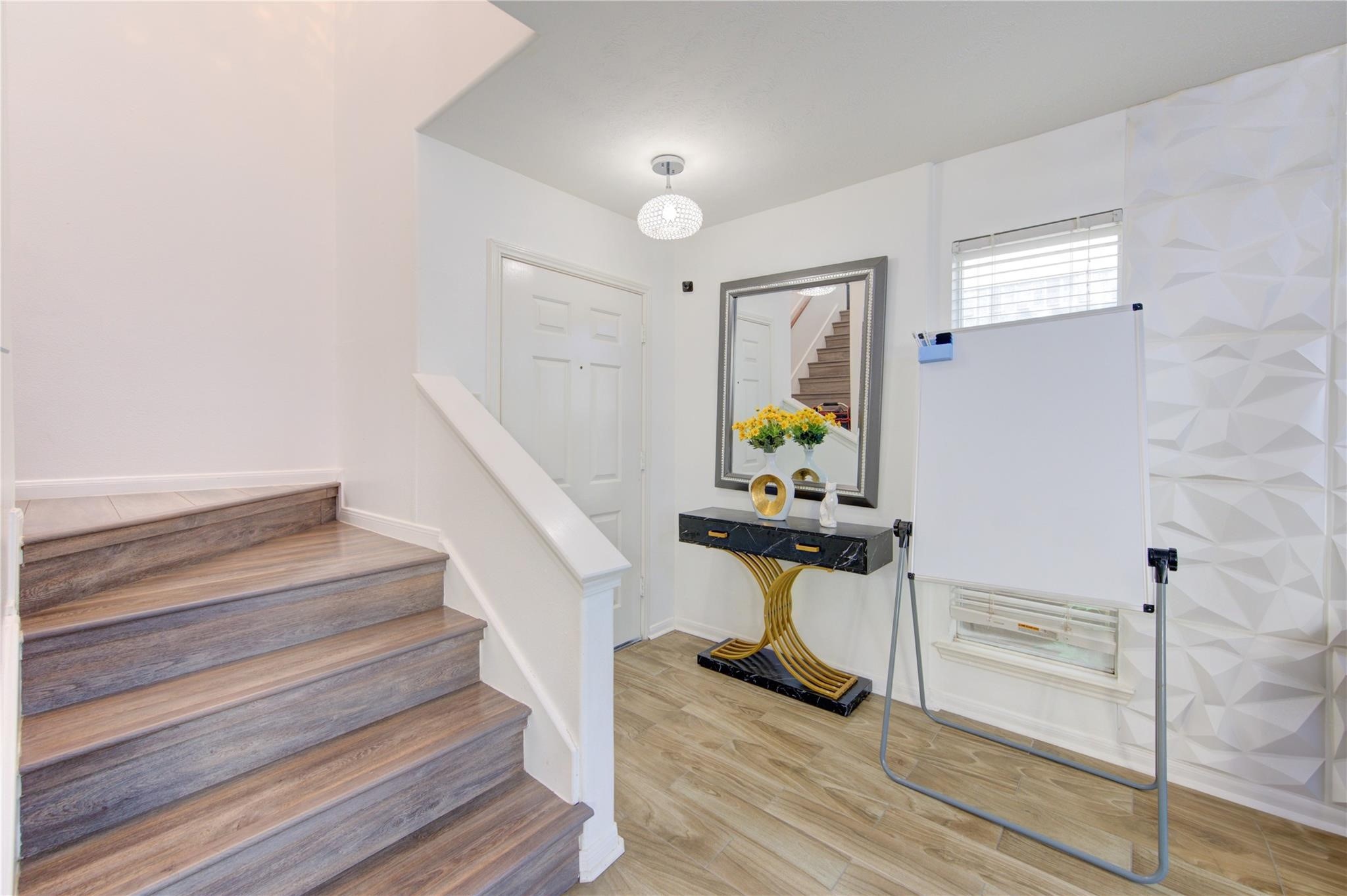 19334 Strathmore Pl Lane Katy, TX 77449 - Photo 10 of 48 a view of entryway and hall with wooden floor