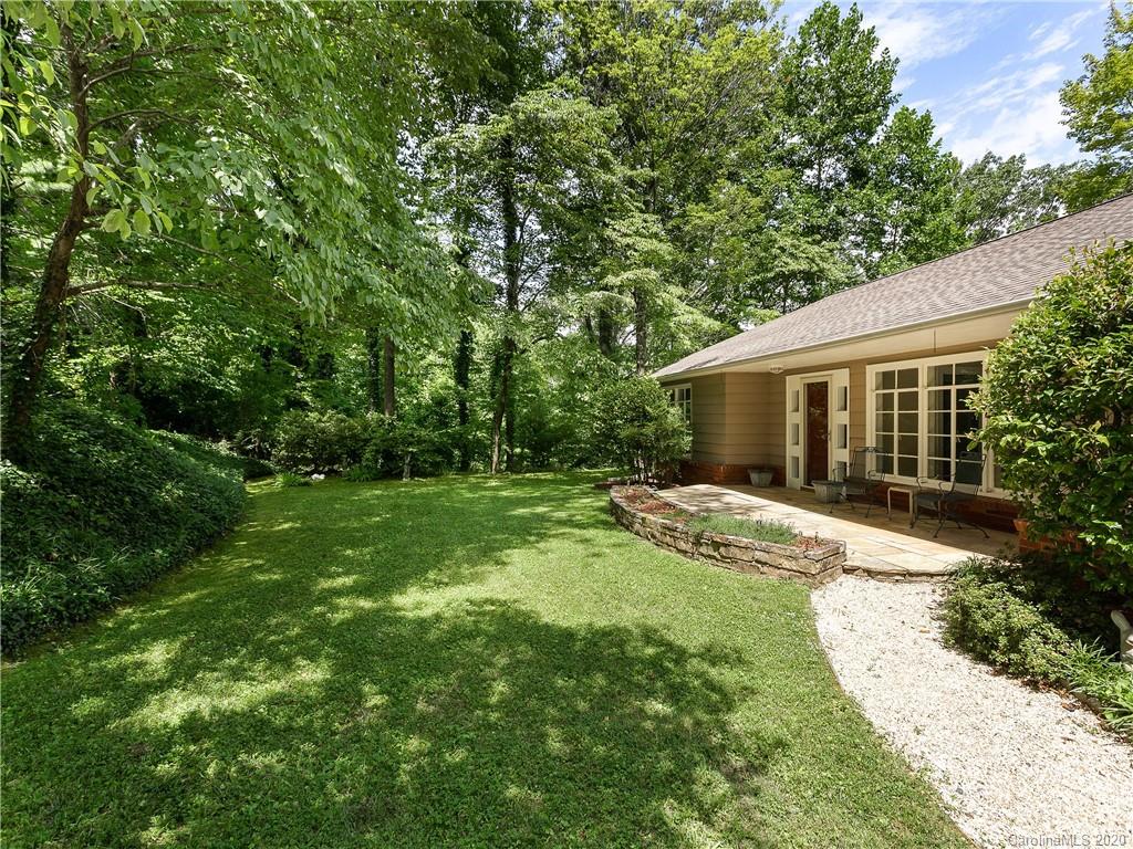 434 Hogback Mountain Road Tryon, NC 28782 - Photo 1 of 37 a view of house with backyard and garden