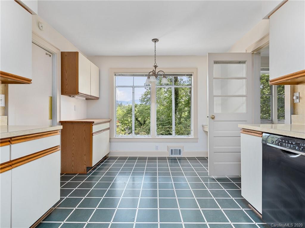 434 Hogback Mountain Road Tryon, NC 28782 - Photo 12 of 37 a kitchen with a window a sink and a counter top space