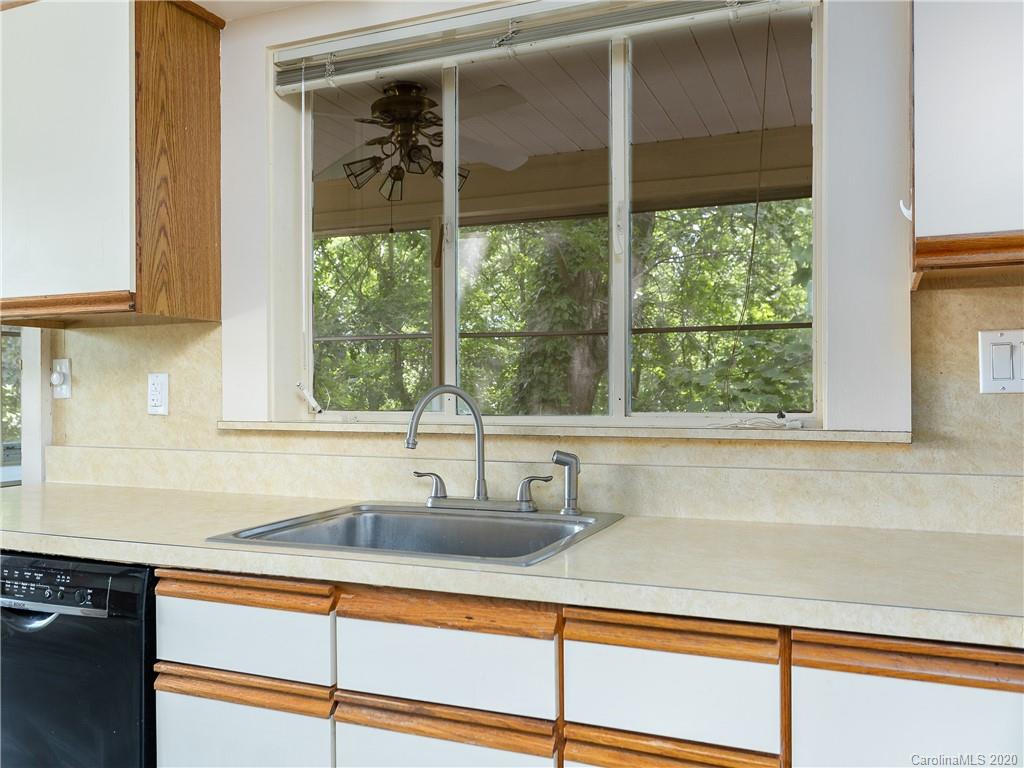 434 Hogback Mountain Road Tryon, NC 28782 - Photo 13 of 37 a kitchen with a sink and large window