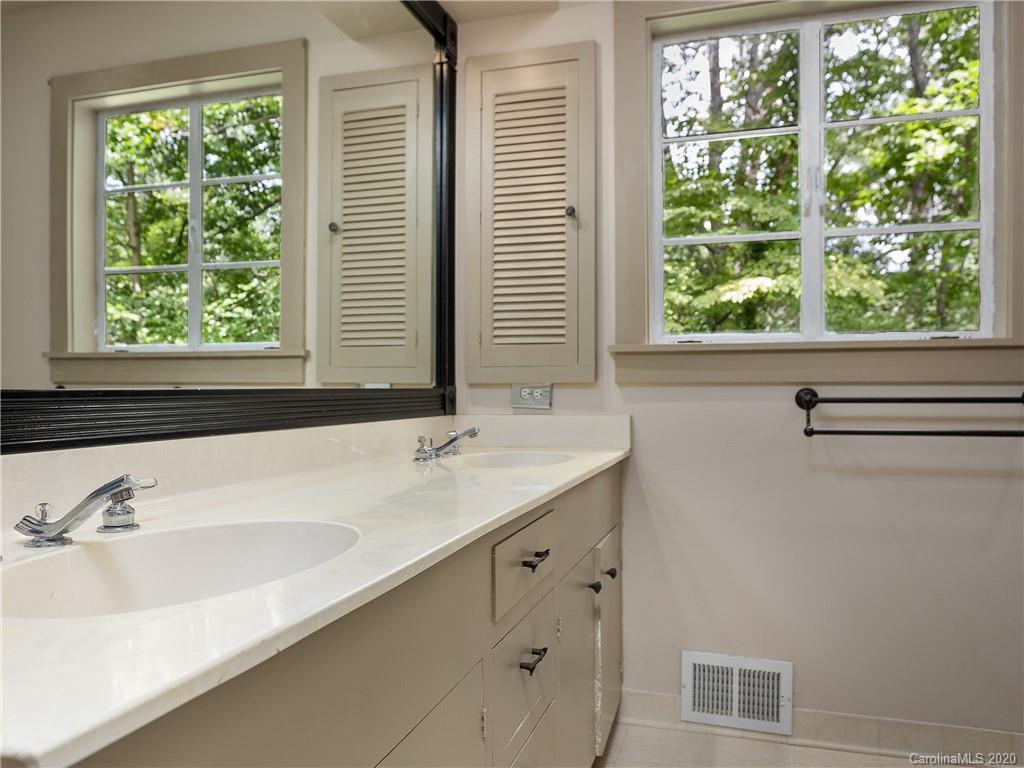434 Hogback Mountain Road Tryon, NC 28782 - Photo 17 of 37 a bathroom with a sink and a window