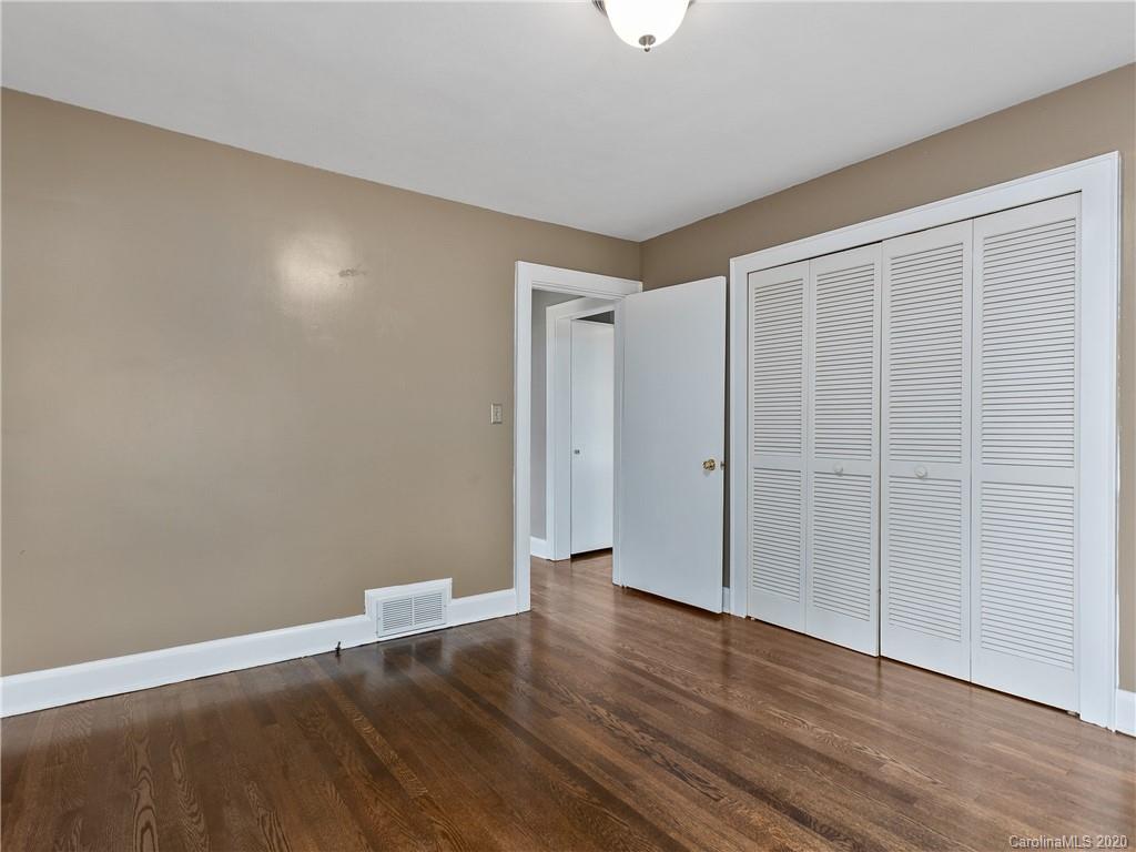 434 Hogback Mountain Road Tryon, NC 28782 - Photo 20 of 37 a view of an empty room with wooden floor