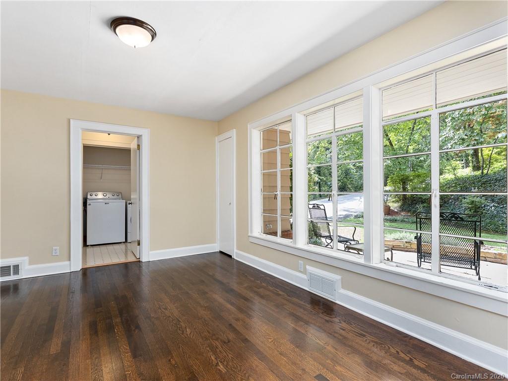 434 Hogback Mountain Road Tryon, NC 28782 - Photo 21 of 37 a view of an empty room with wooden floor and a window
