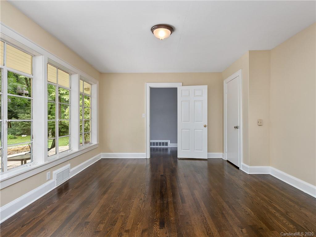 434 Hogback Mountain Road Tryon, NC 28782 - Photo 22 of 37 a view of empty room with wooden floor and fan