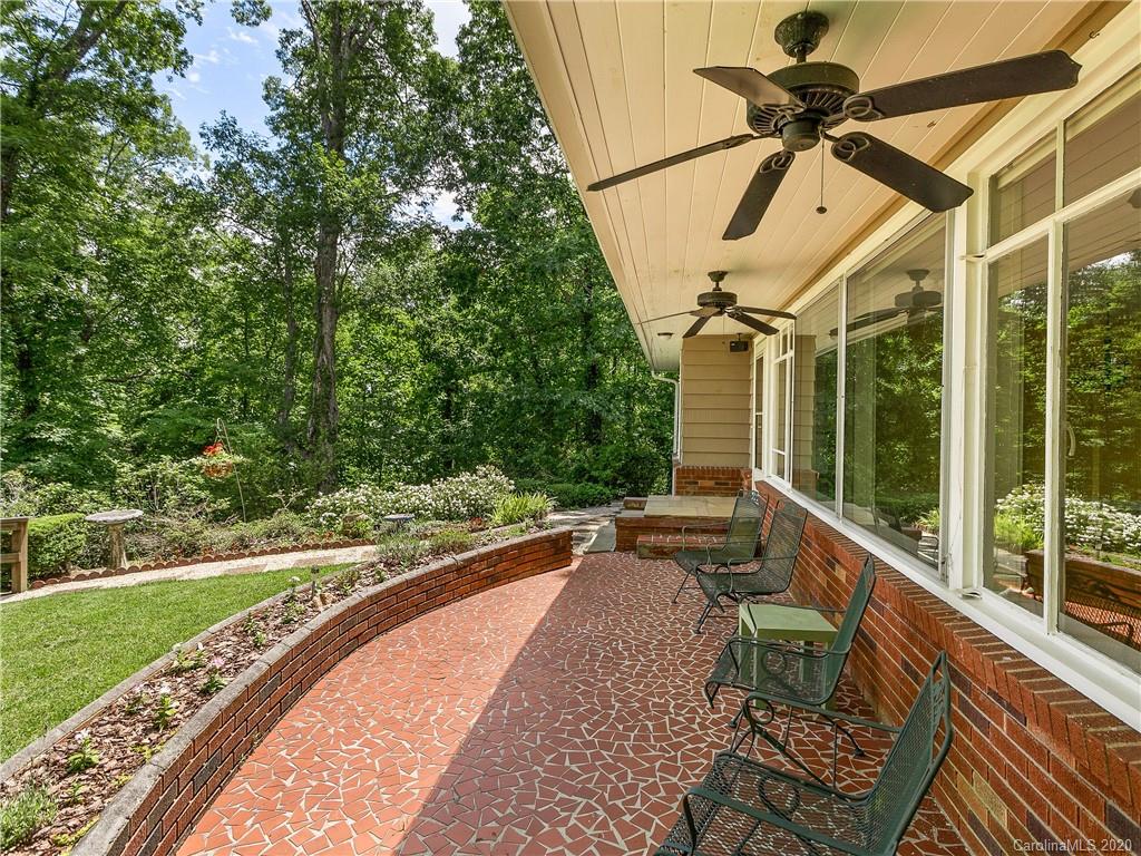 434 Hogback Mountain Road Tryon, NC 28782 - Photo 31 of 37 a view of a porch with furniture and a yard