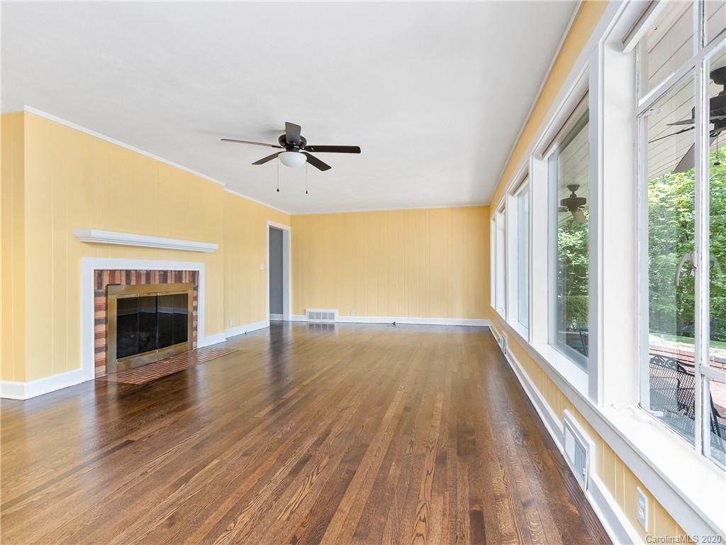 434 Hogback Mountain Road Tryon, NC 28782 - Photo 9 of 37 a view of a room with wooden floor and a fireplace