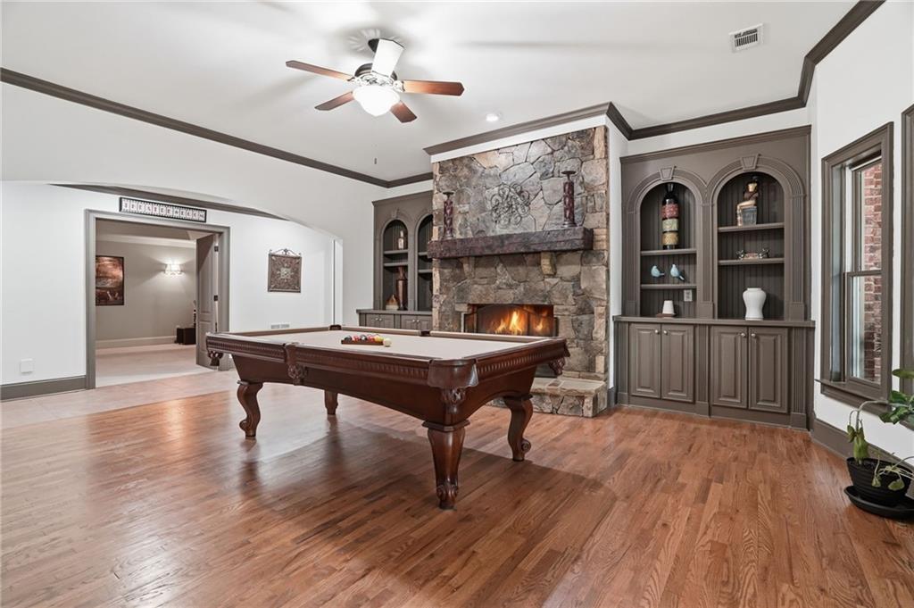 8340 Colonial Place Duluth, GA 30097 - Photo 48 of 74 a living room with furniture and a wooden floor