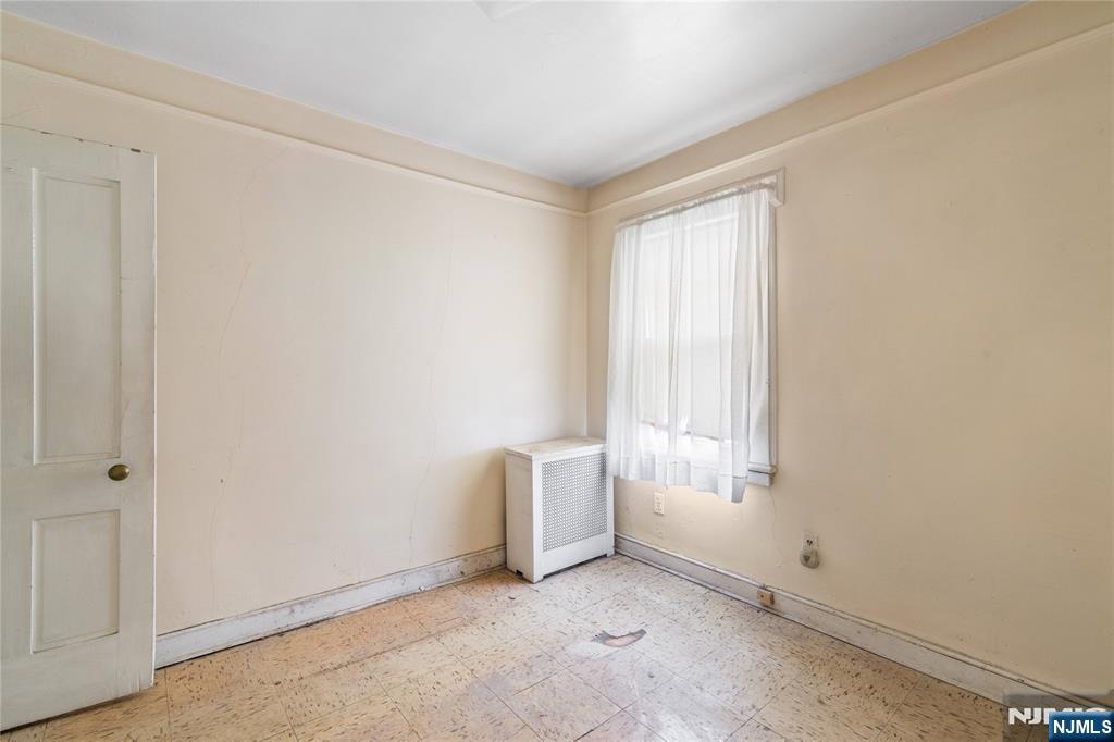 354 Hayward Street Orange, NJ 07050 - Photo 13 of 18 an empty room with windows