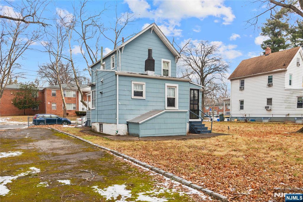 354 Hayward Street Orange, NJ 07050 - Photo 18 of 18 a view of a house with snow on the road