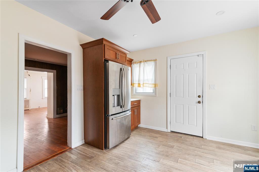 354 Hayward Street Orange, NJ 07050 - Photo 5 of 18 a view of a hallway with wooden floor and cabinet