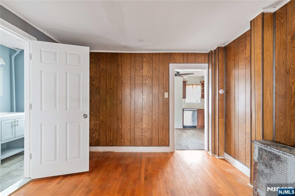 354 Hayward Street Orange, NJ 07050 - Photo 8 of 18 a view of an empty room with wooden floor and a window