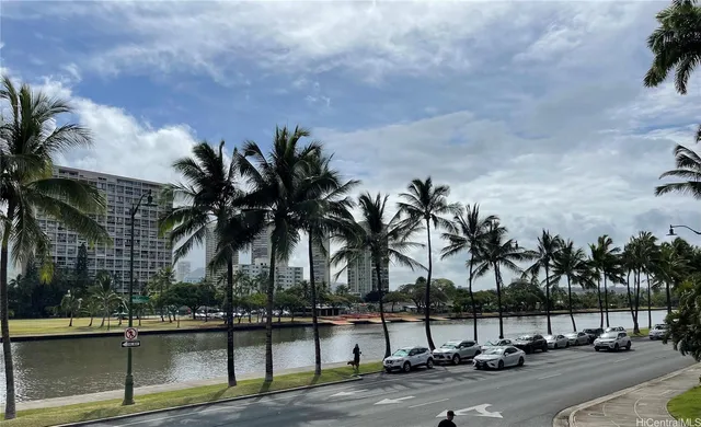 a view of a street with a building in the background