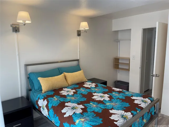 a bedroom with bed and a lamp