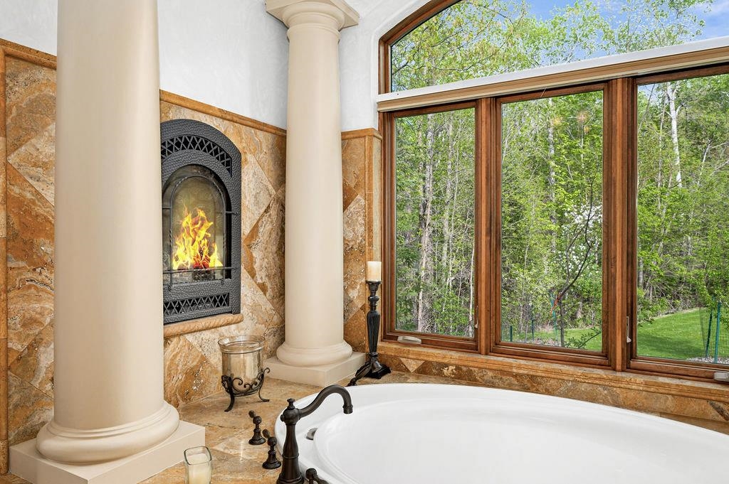 3993 Scenic View Road Moose Lake, MN 55767 - Photo 30 of 48 Primary bathroom with soaking tub and gas fireplace