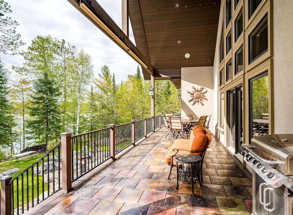 3993 Scenic View Road Moose Lake, MN 55767 - Photo 36 of 48 Front patio with grilling area, balcony and view of the lake