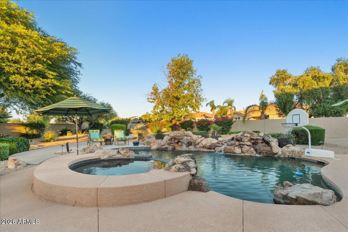 6427 South Magic Court Gilbert, AZ 85298 - Photo 3 of 71 a view of a lake with a house