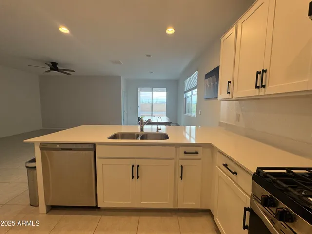 a kitchen with a sink and cabinets