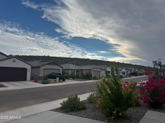 a couple of cars parked in front of house
