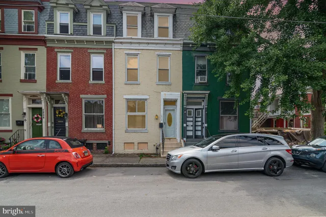 a cars parked in front of a building