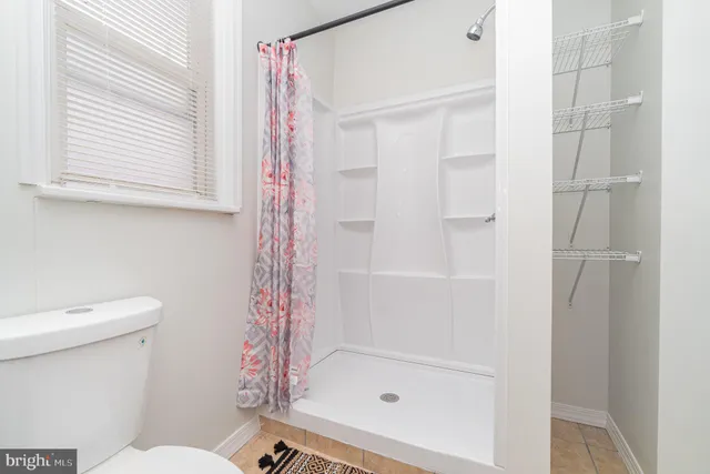 a view of an empty room with windows