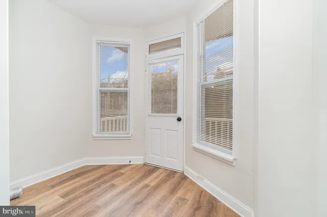 an empty room with windows