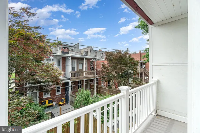 a view of a car parked on the road