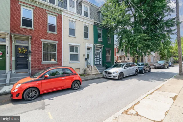 a cars parked in front of a building