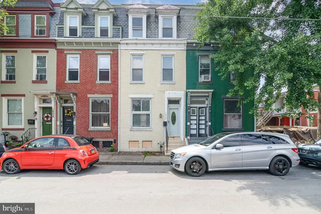 a cars parked in front of a building