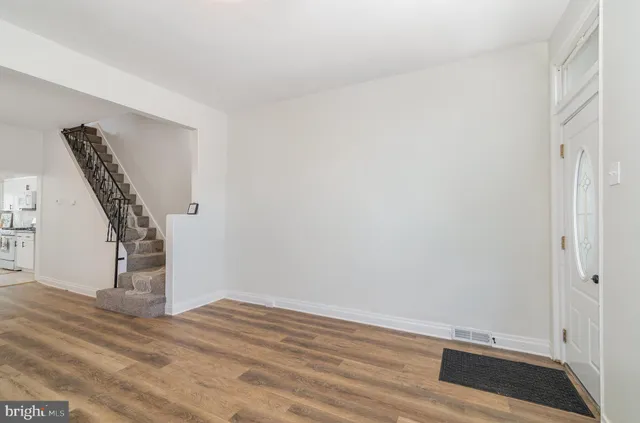 a view of entryway with wooden floor
