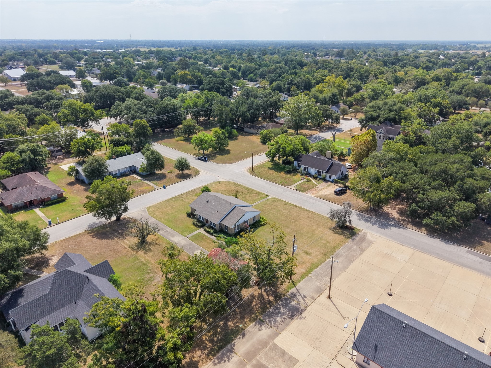 810 Main Street Hempstead, TX 77445 - Photo 31 of 32 Wide aerial view highlighting the corner setting, open yard space, and convenient access to the surrounding area.