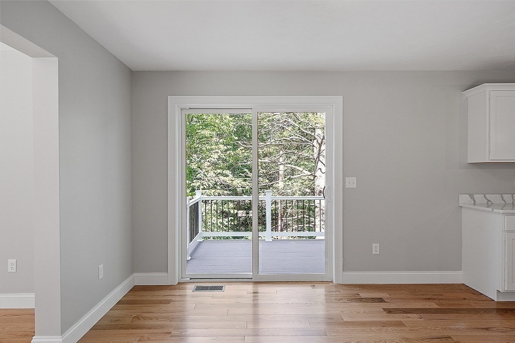 98 Knower Road Westminster, MA 01473 - Photo 17 of 42 a view of empty room with wooden floor and fan