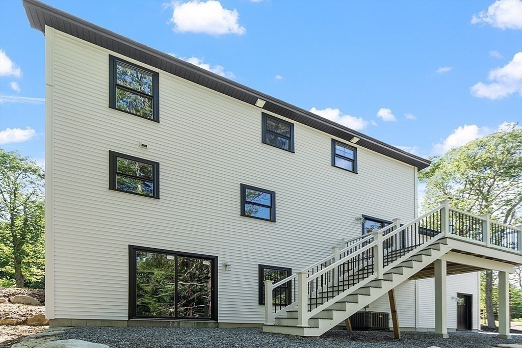 98 Knower Road Westminster, MA 01473 - Photo 40 of 42 a view of a house with pool and deck