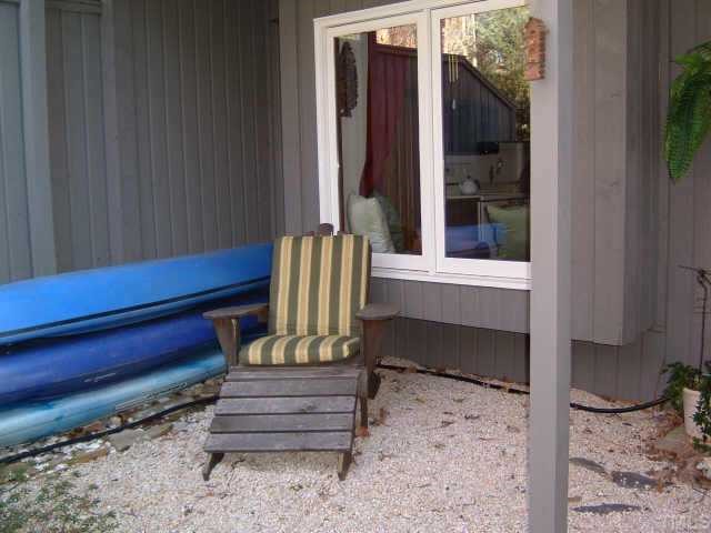 4351 Southwind Drive Raleigh, NC 27613 - Photo 11 of 12 a view of a bench in a backyard