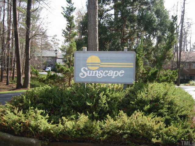 4351 Southwind Drive Raleigh, NC 27613 - Photo 12 of 12 a sign that is sitting in front of flowers