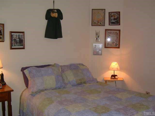 4351 Southwind Drive Raleigh, NC 27613 - Photo 10 of 12 a room with a bed
