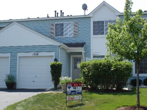 1336 Normantown Road, Unit 1336 Naperville, IL 60564 - Photo 1 of 1 a front view of a house with garden