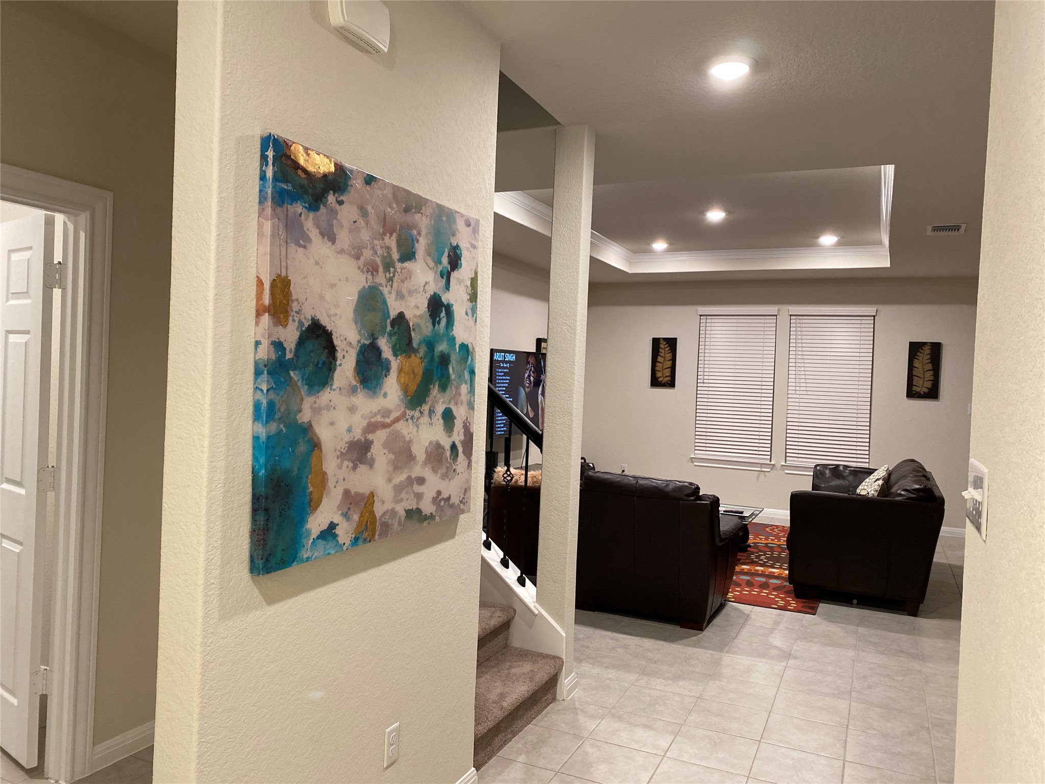197 Prairie Falcon Way Leander, TX 78641 - Photo 13 of 29 Hallway with a textured wall, recessed lighting, a raised ceiling, and light tile patterned floors