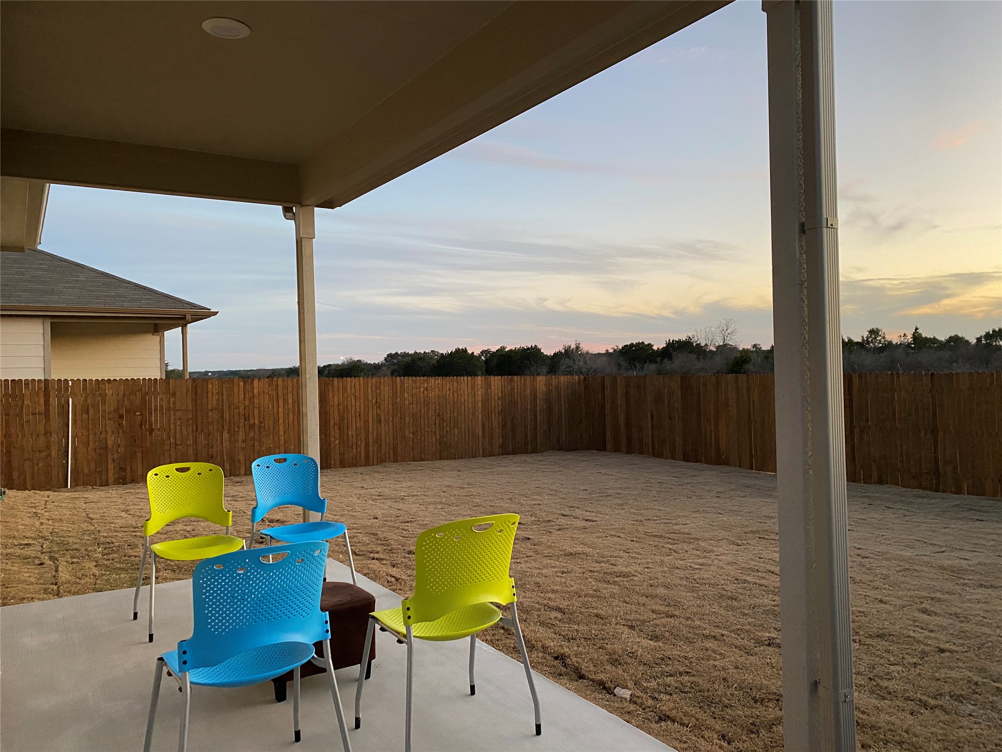 197 Prairie Falcon Way Leander, TX 78641 - Photo 28 of 29 Patio terrace at dusk featuring a patio area and a fenced backyard