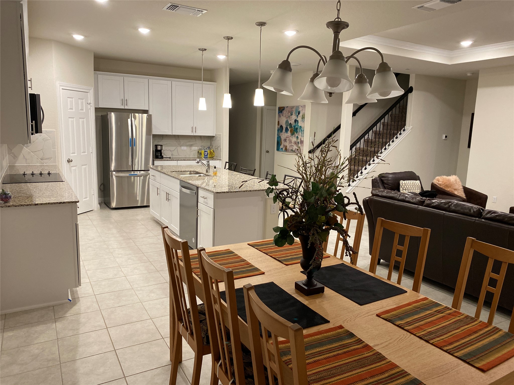 197 Prairie Falcon Way Leander, TX 78641 - Photo 7 of 29 Dining space with recessed lighting and light tile patterned floors
