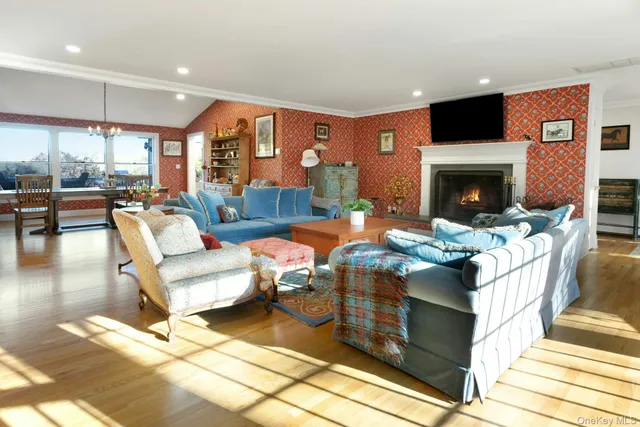 a living room with fireplace furniture and a fireplace