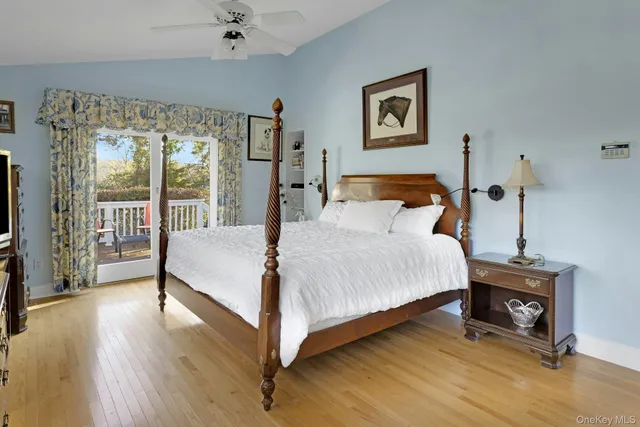 a bedroom with a bed and a tv