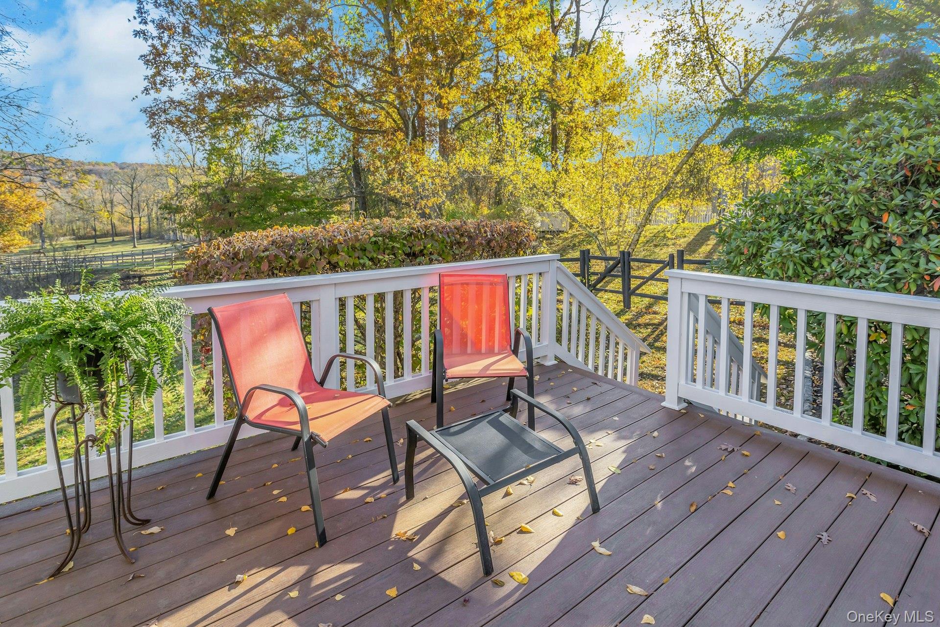 90 Cushman Road Patterson, NY 12563 - Photo 24 of 40 a balcony with wooden floor table and chairs