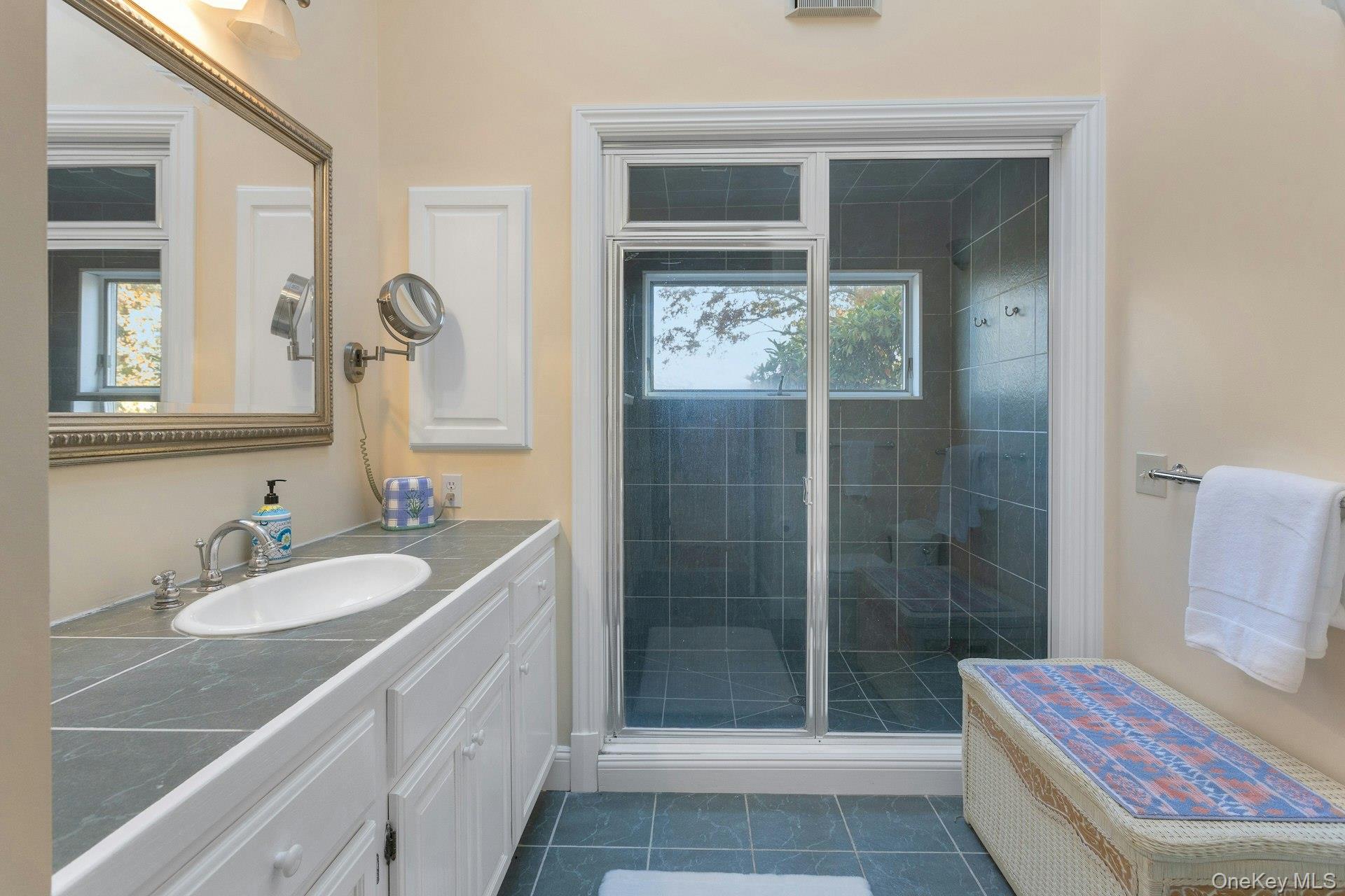 90 Cushman Road Patterson, NY 12563 - Photo 25 of 40 a bathroom with a sink and a mirror